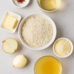 “Ingredients for Risotto alla Milanese – Arborio rice, saffron, butter, onion, Parmesan, white wine, and broth”