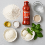 Pizza Margherita ingredients: Italian 00 flour, mozzarella, tomato passata, basil, olive oil, yeast, salt, water.