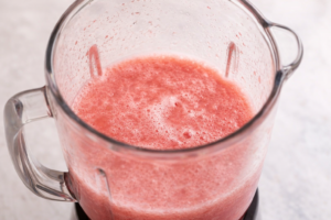 Blending fresh watermelon until smooth for watermelon agua fresca