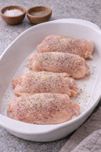 Seasoned raw chicken thighs ready for miso chicken ramen.